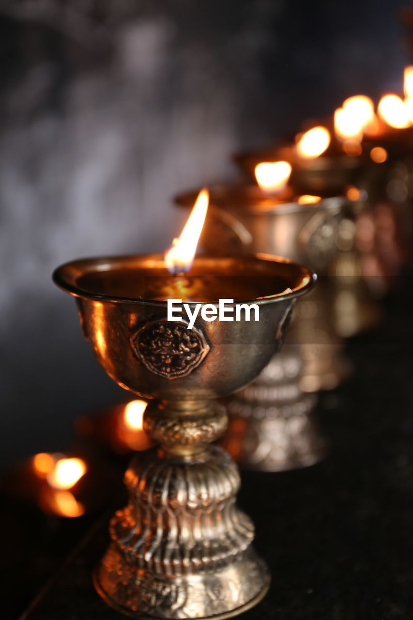 Close-up of diya in temple