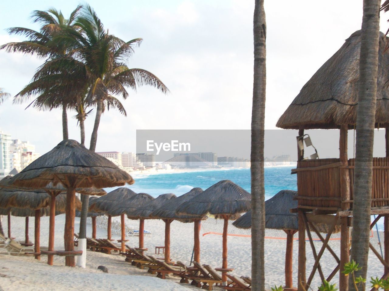 GAZEBO ON BEACH AGAINST SKY