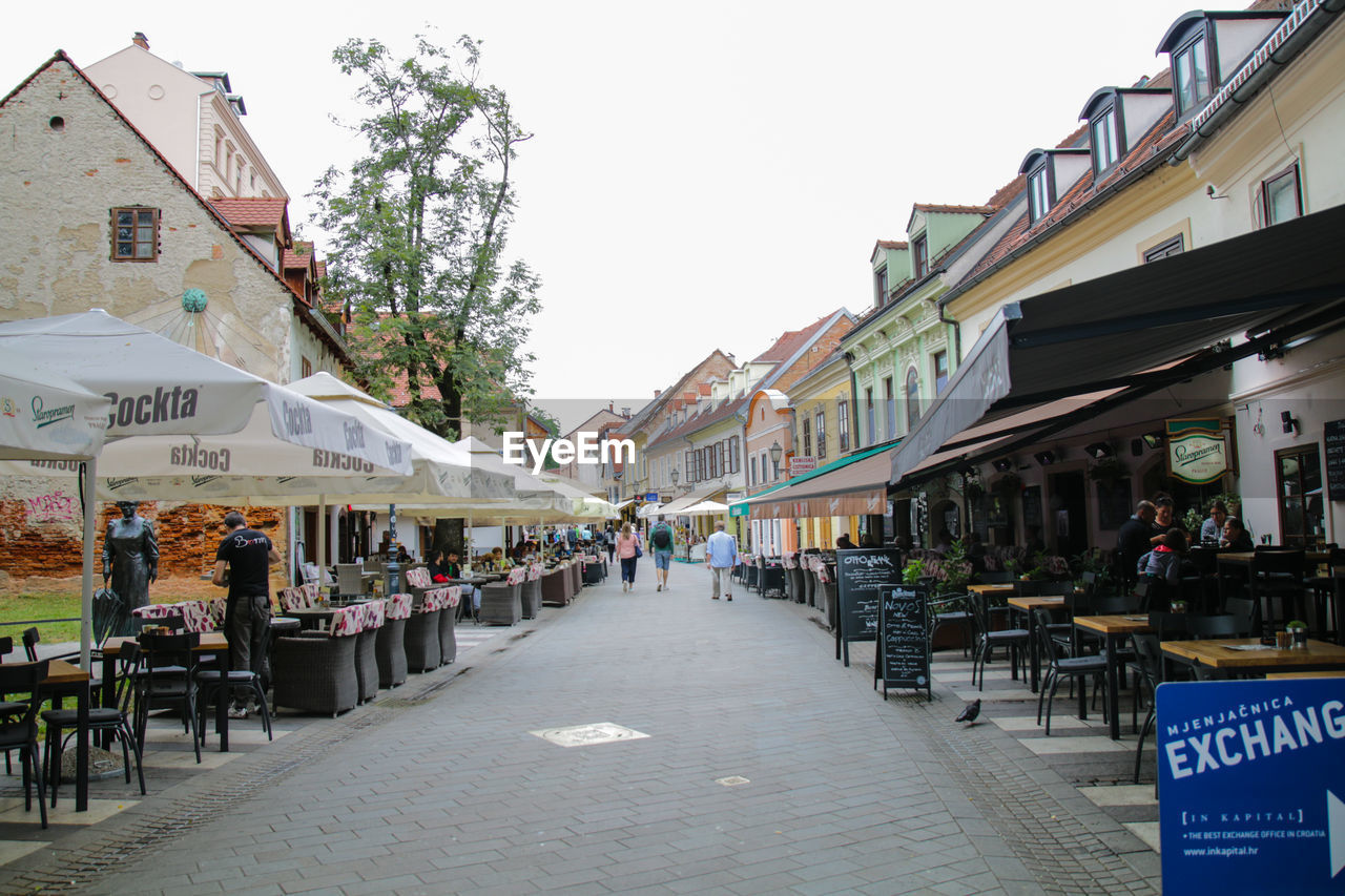STREET AMIDST BUILDINGS IN CITY