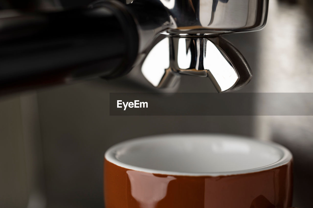 A closeup shot of an espresso coffee machine