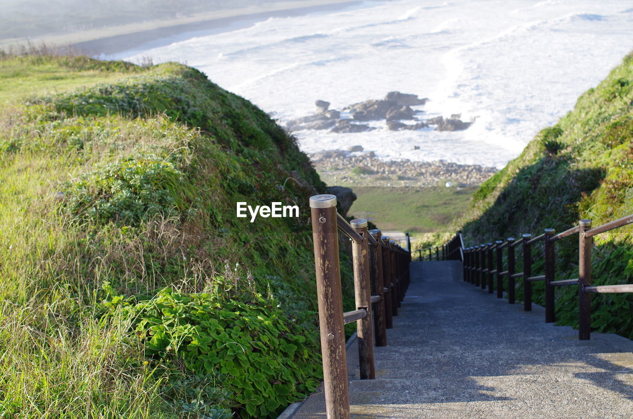 SCENIC VIEW OF MOUNTAIN BY SEA