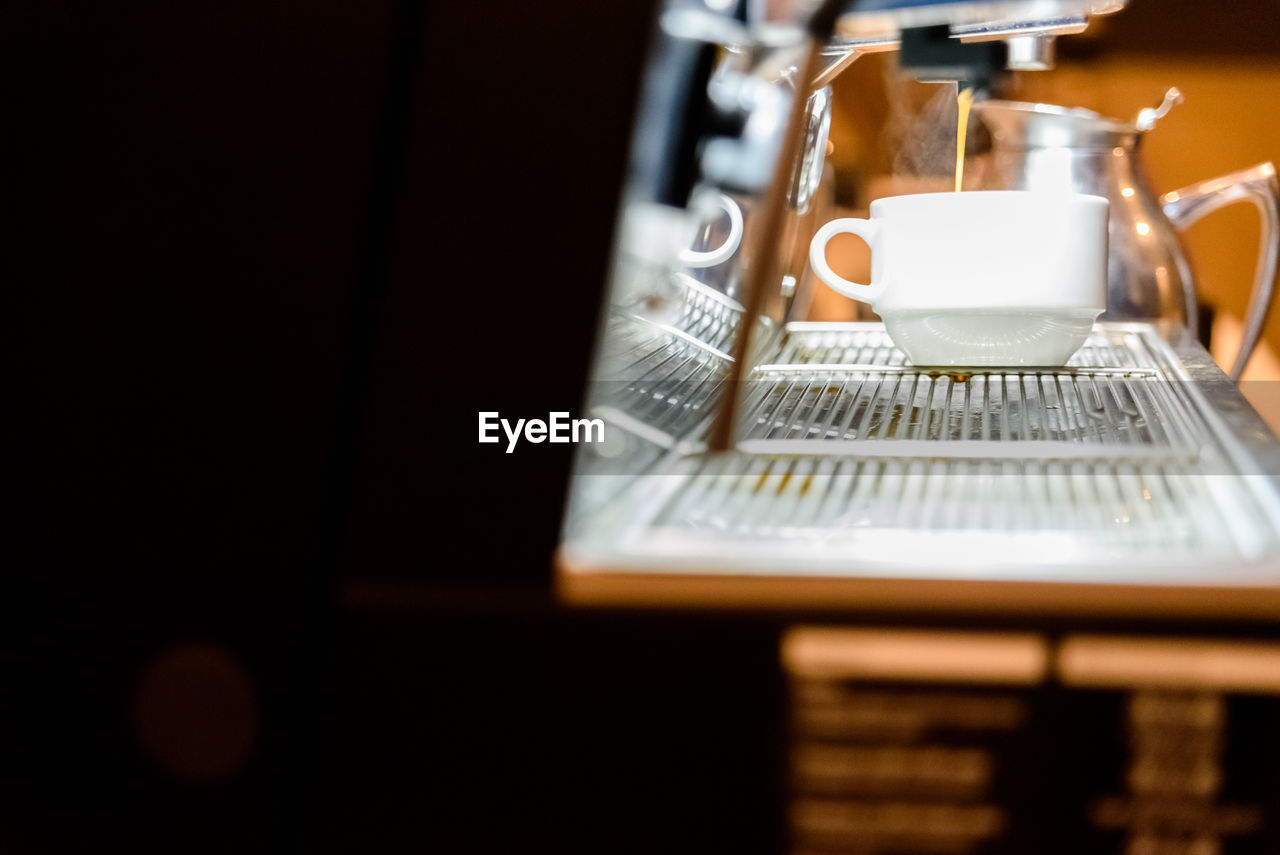 CLOSE-UP OF COFFEE ON TABLE AT HOME