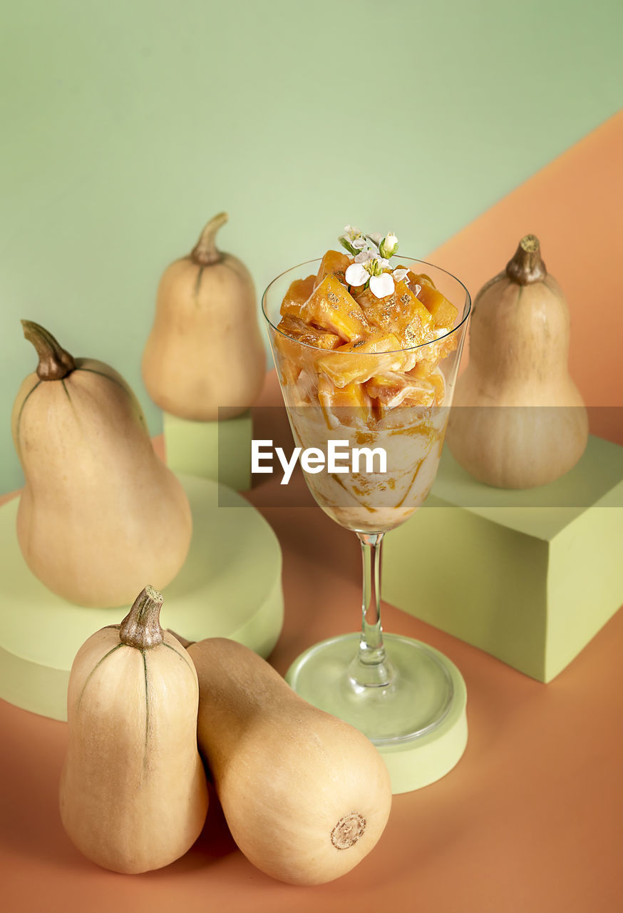 CLOSE-UP OF FRUITS ON TABLE AGAINST GLASS