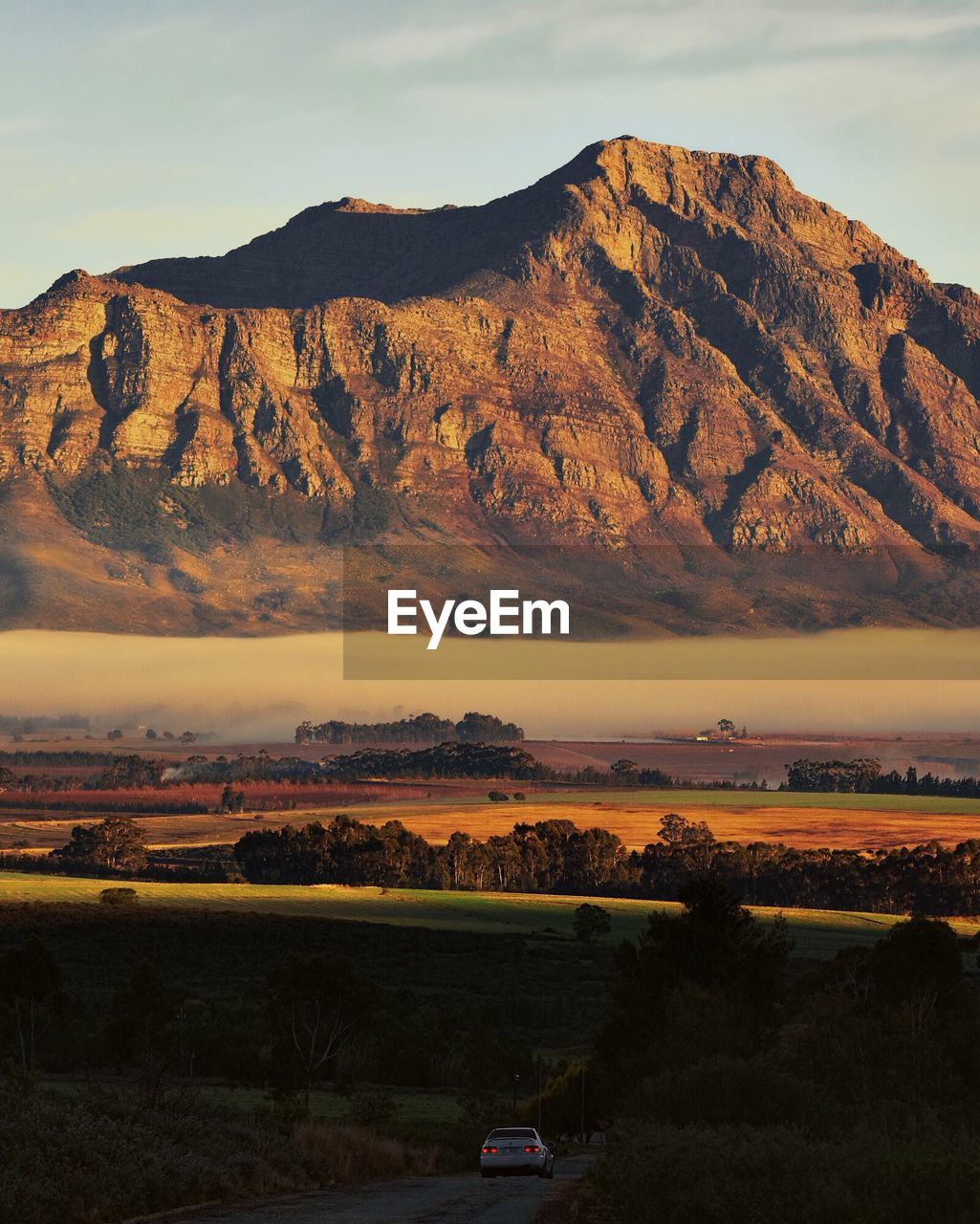 Scenic view of landscape against sky during sunset