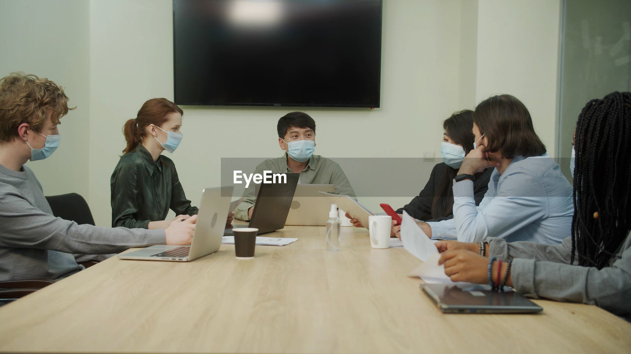 Group of people working on table