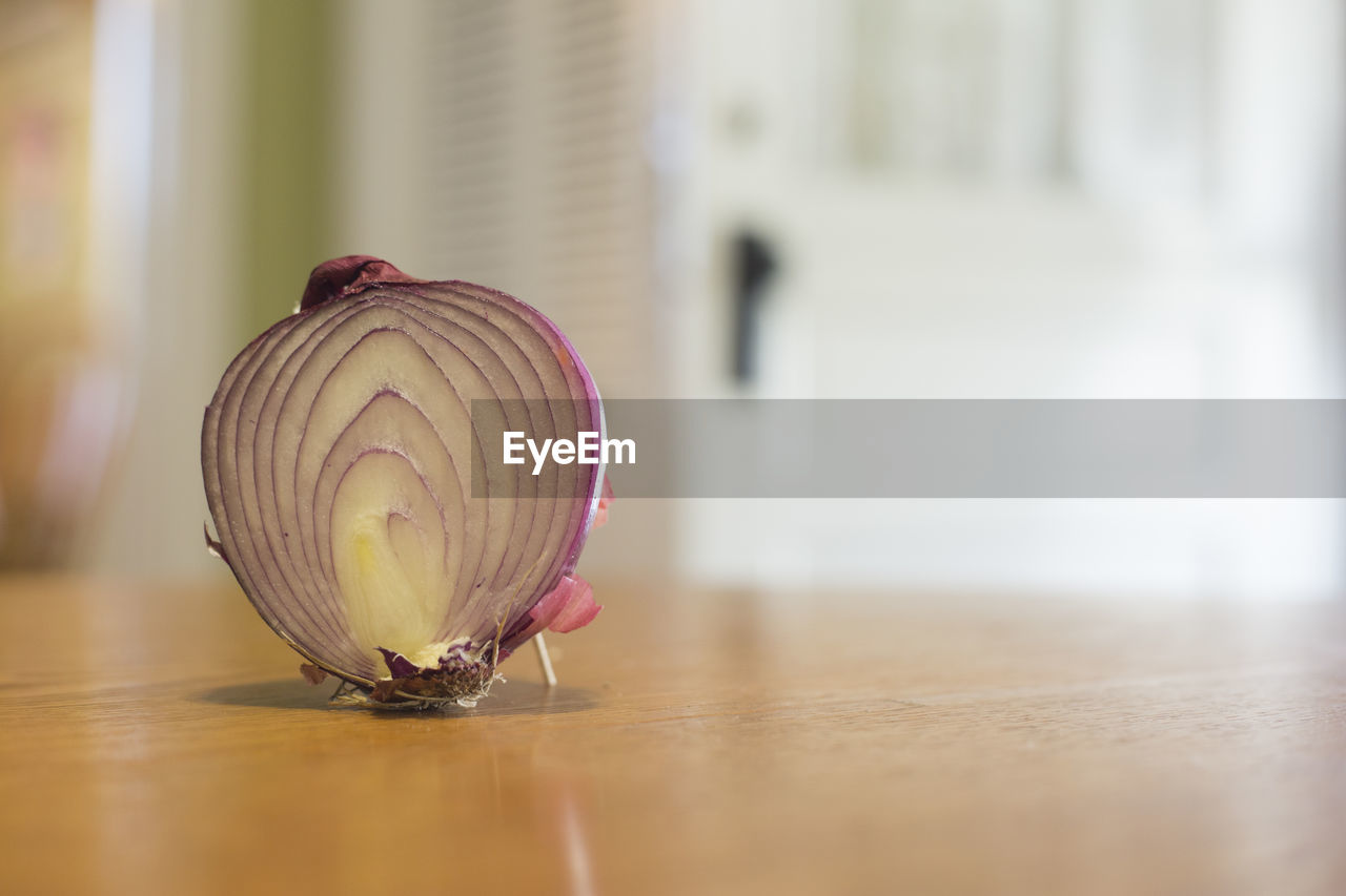 Close-up of halved onion on table