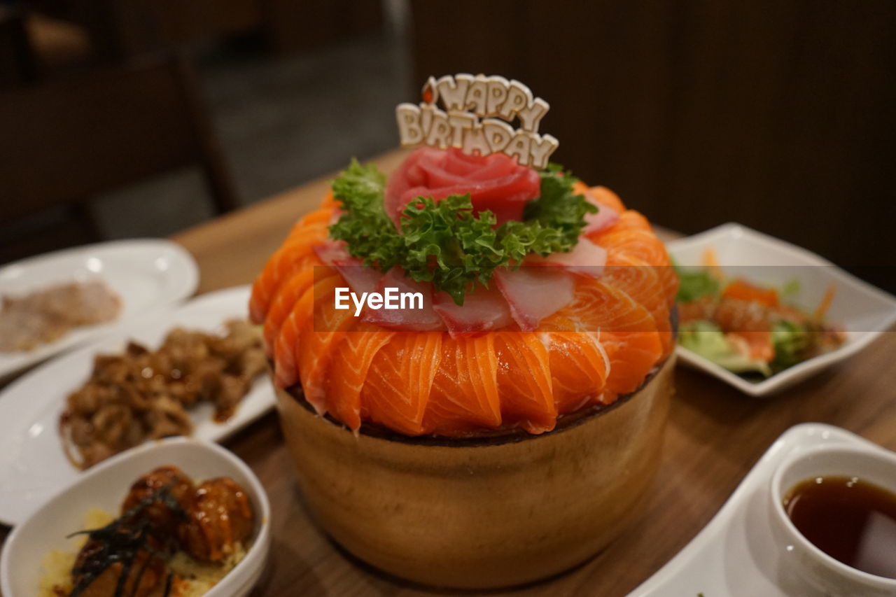 CLOSE-UP OF FRUITS ON TABLE