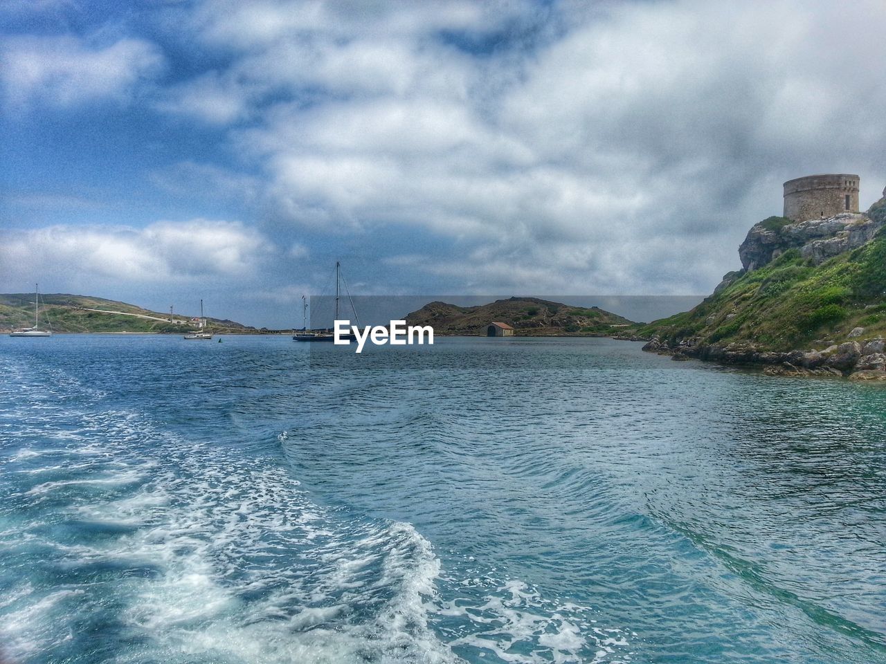 Scenic view of sea against cloudy sky