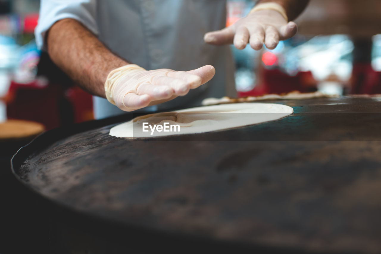 Close-up of man preparing food