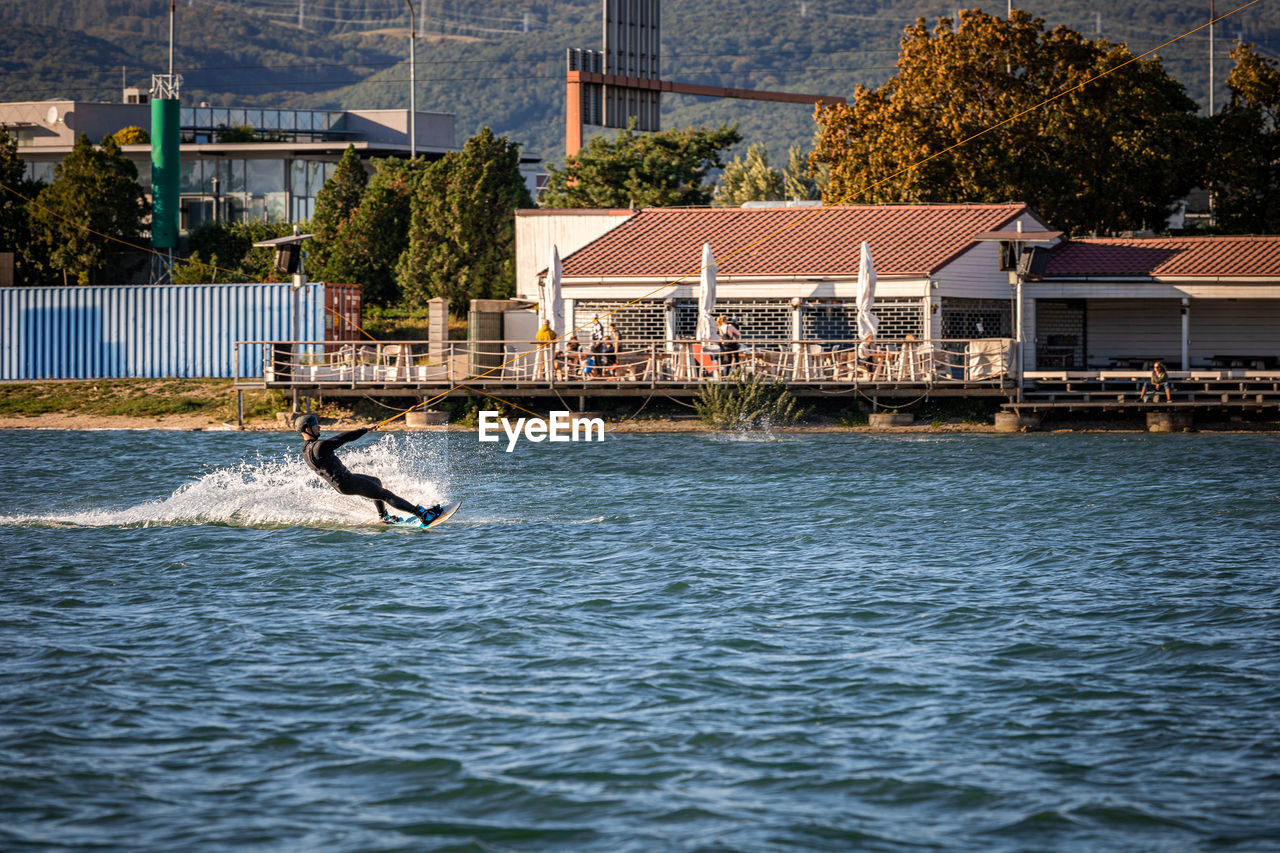 VIEW OF A JUMPING OVER SEA