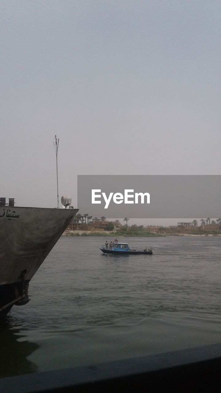 VIEW OF BOATS IN SEA