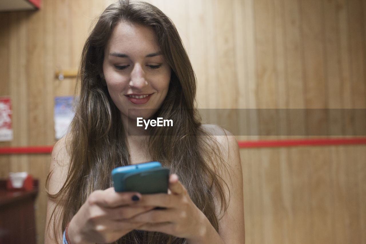 A young women on her cell phone.