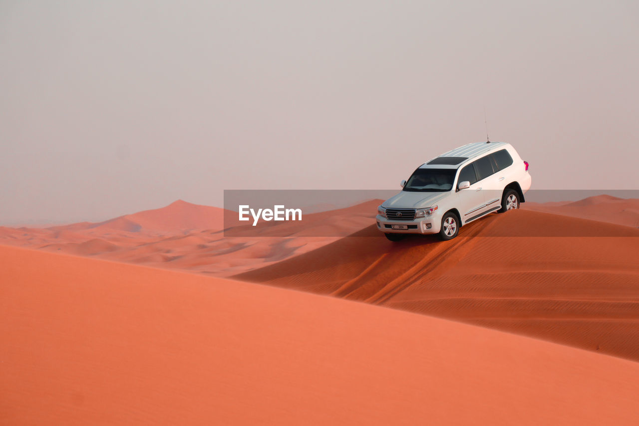 VIEW OF CAR ON DESERT