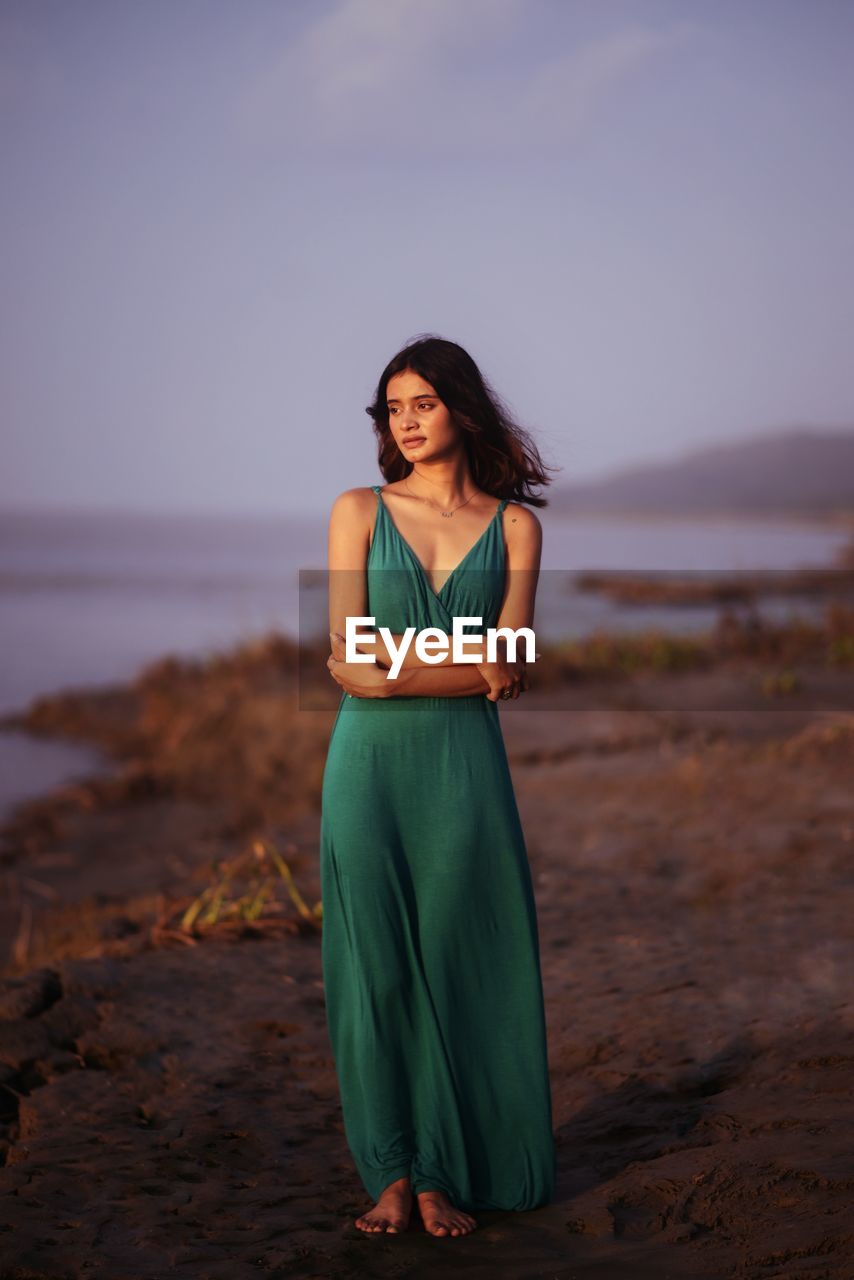 Young woman standing at beach