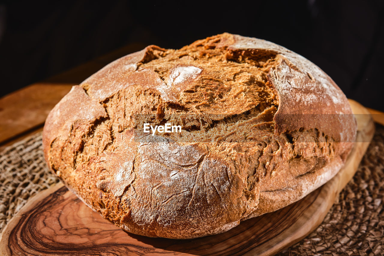 Freshly baked artisan rye bread on the table, close-up. homemade bread with whole wheat flour.
