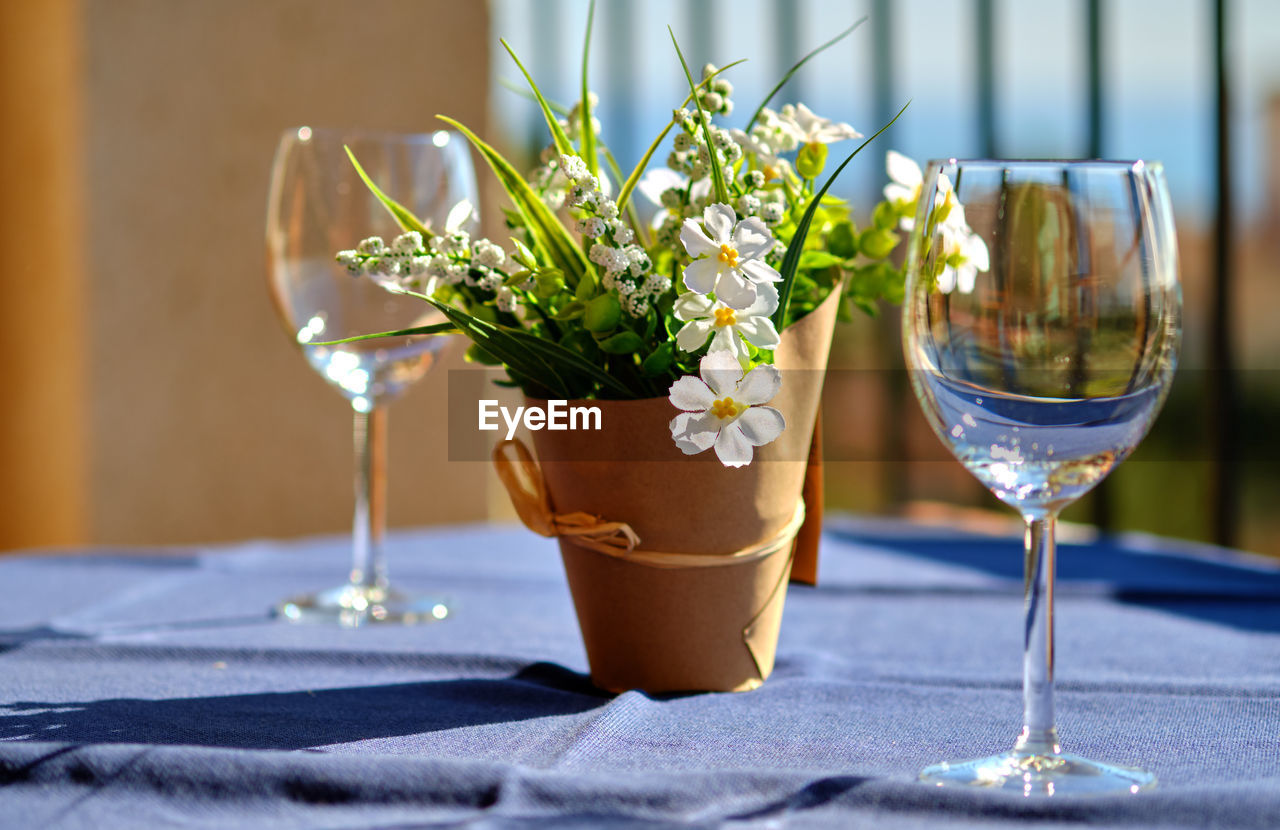 CLOSE-UP OF WINEGLASS ON TABLE