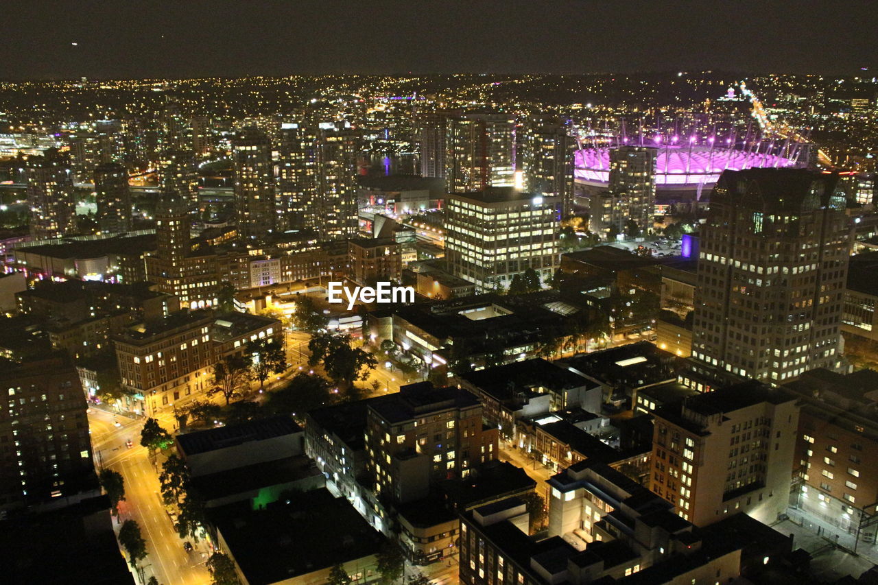 HIGH ANGLE VIEW OF ILLUMINATED CITY