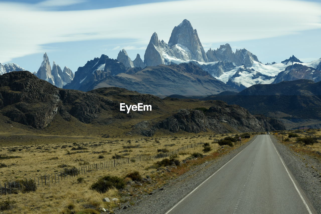 Road amidst mountains against sky