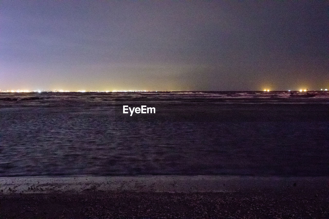 VIEW OF SEA AGAINST SKY AT NIGHT