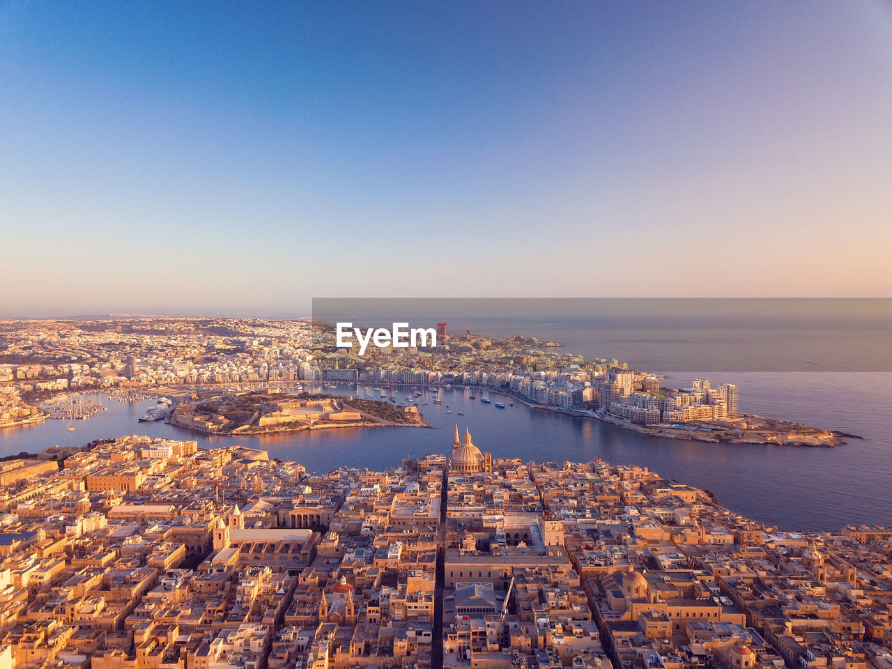 Aerial view of valletta city in malta during sunrise.