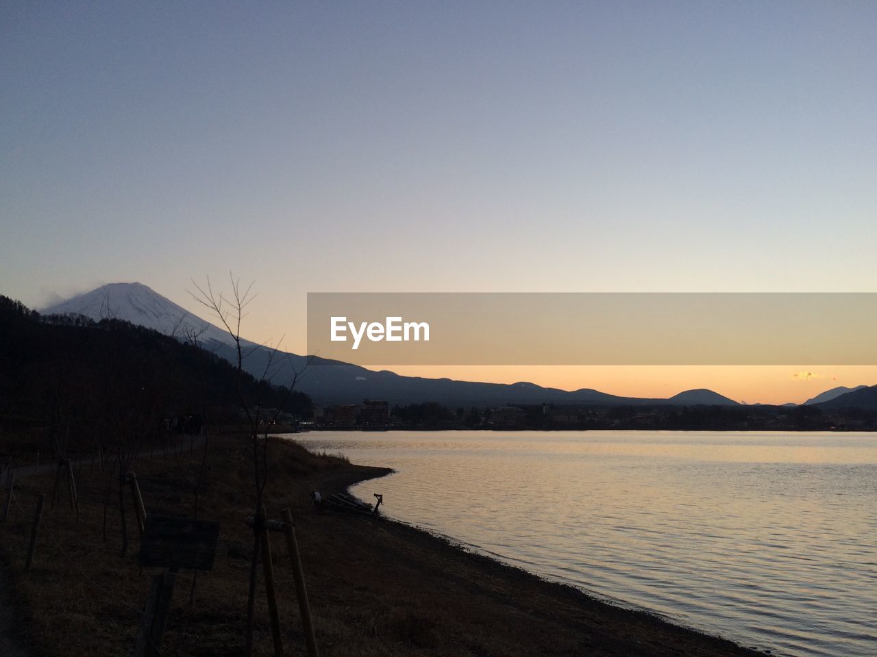 View of lake against sky during sunset