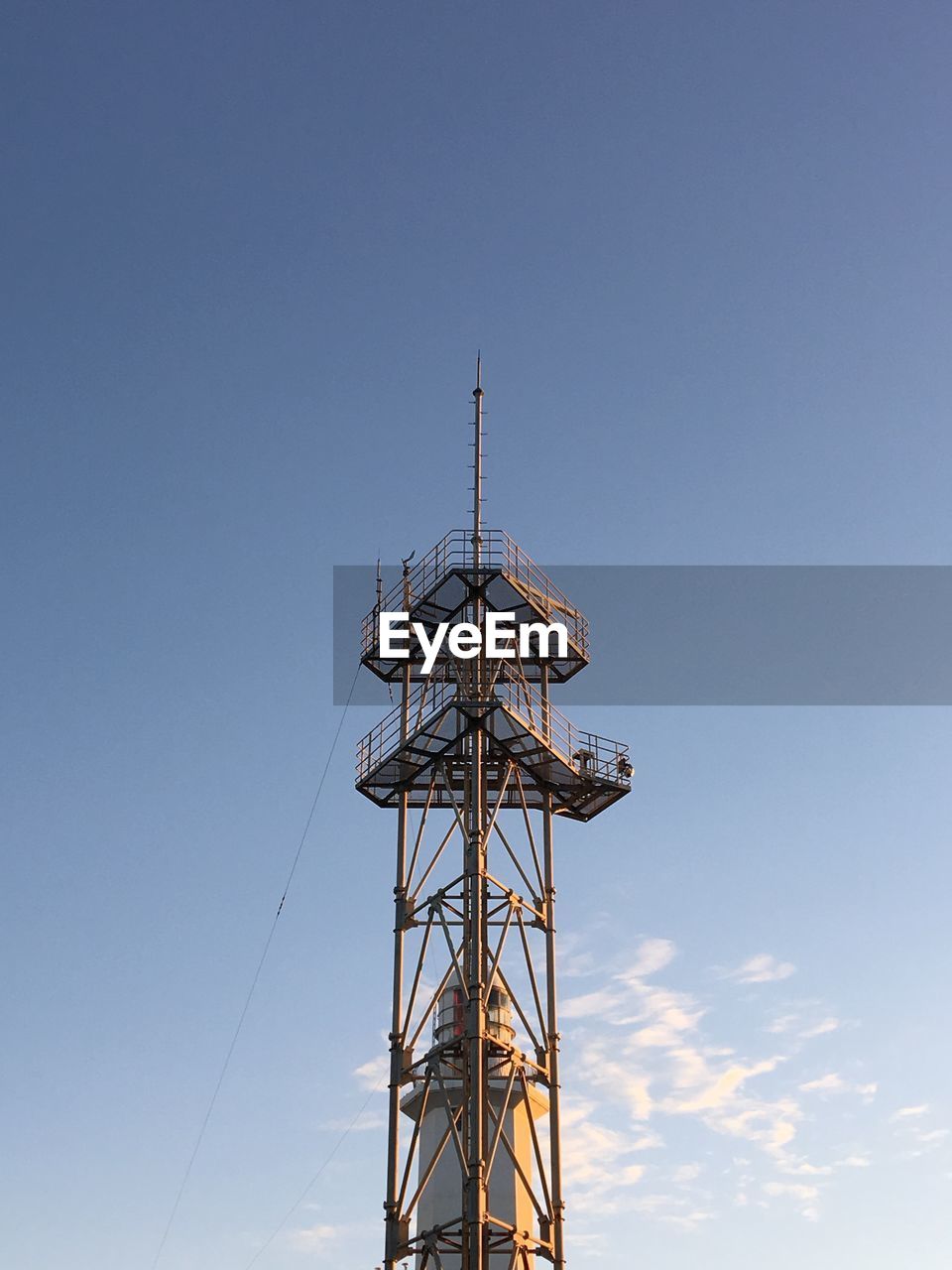 LOW ANGLE VIEW OF COMMUNICATIONS TOWER AGAINST CLEAR SKY