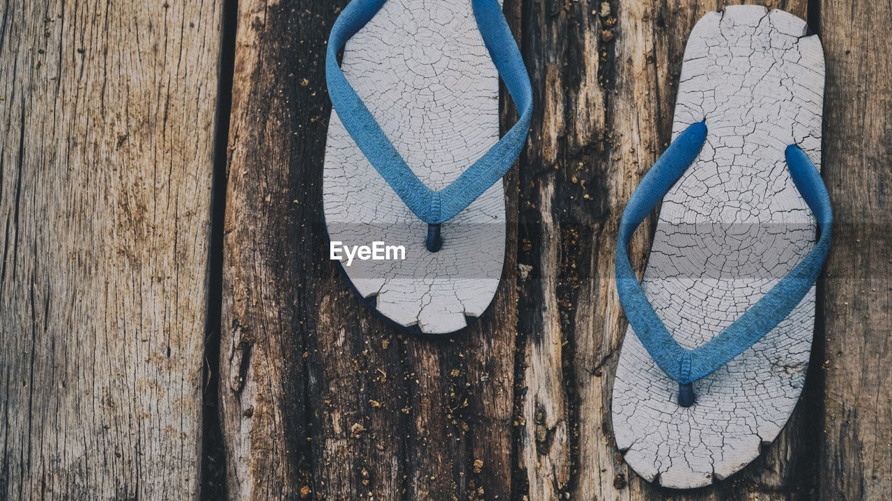 Directly above shot of old flip-flops on table