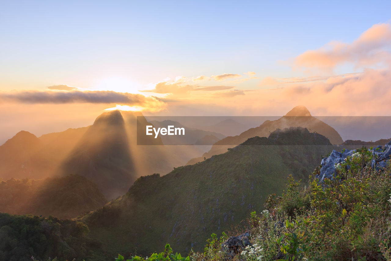 SCENIC VIEW OF MOUNTAINS DURING SUNSET