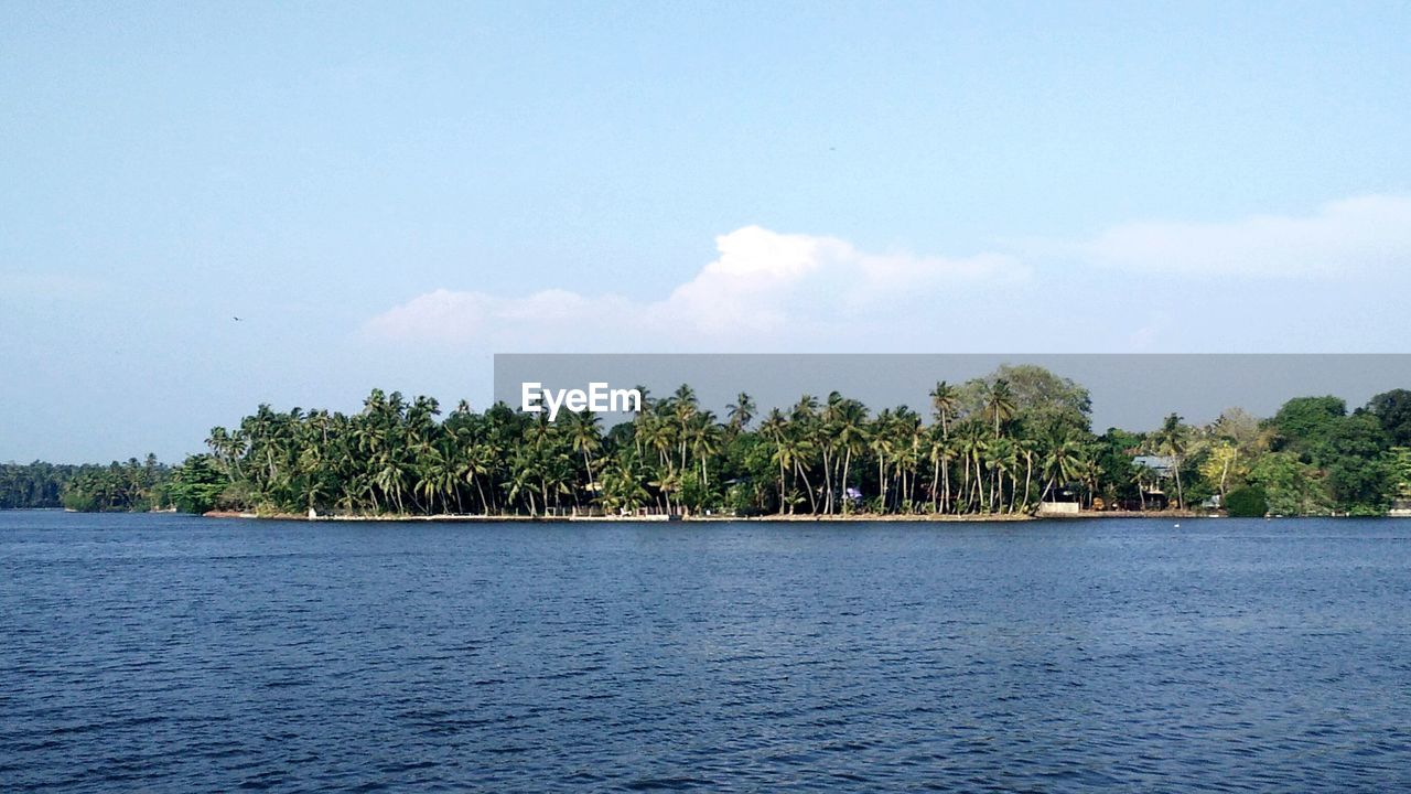 Scenic view of landscape against blue sky