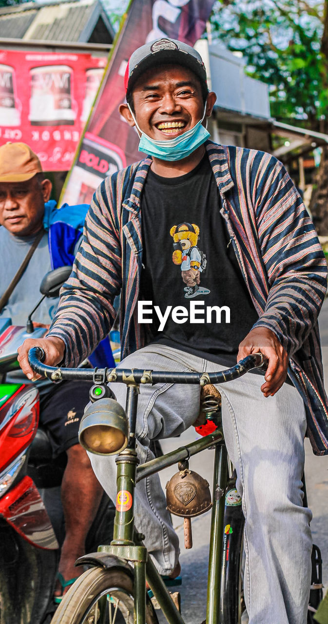 Portrait of woman riding bicycles on street