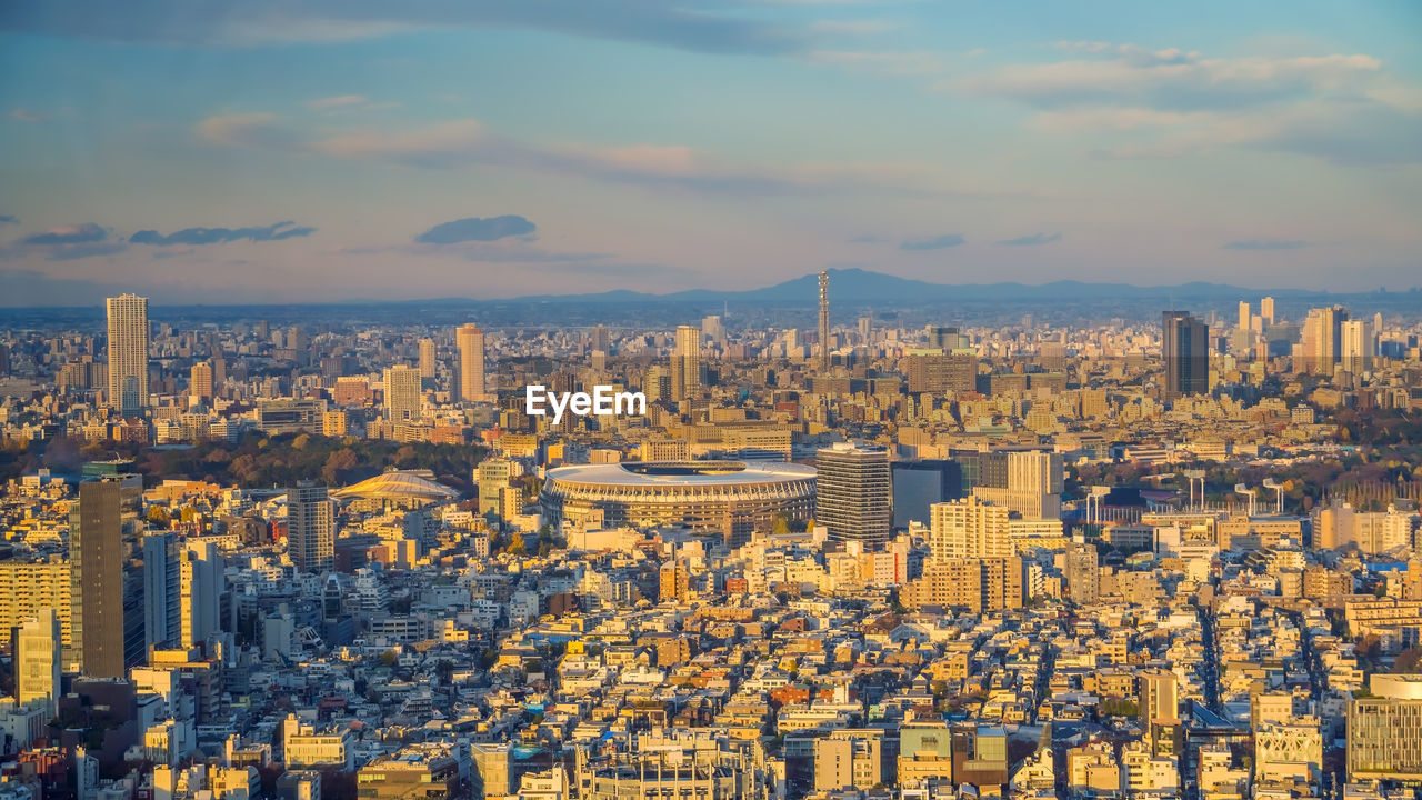 High angle view of buildings in city against sky