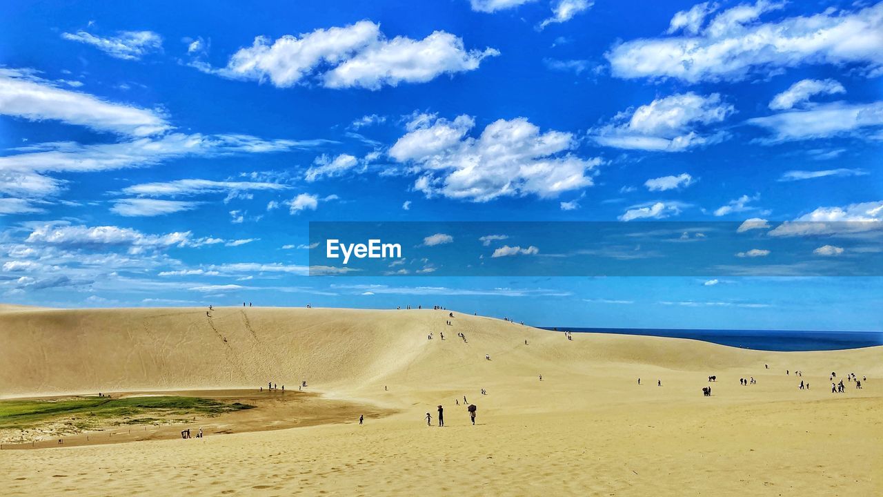 Scenic view of sand dune against sky