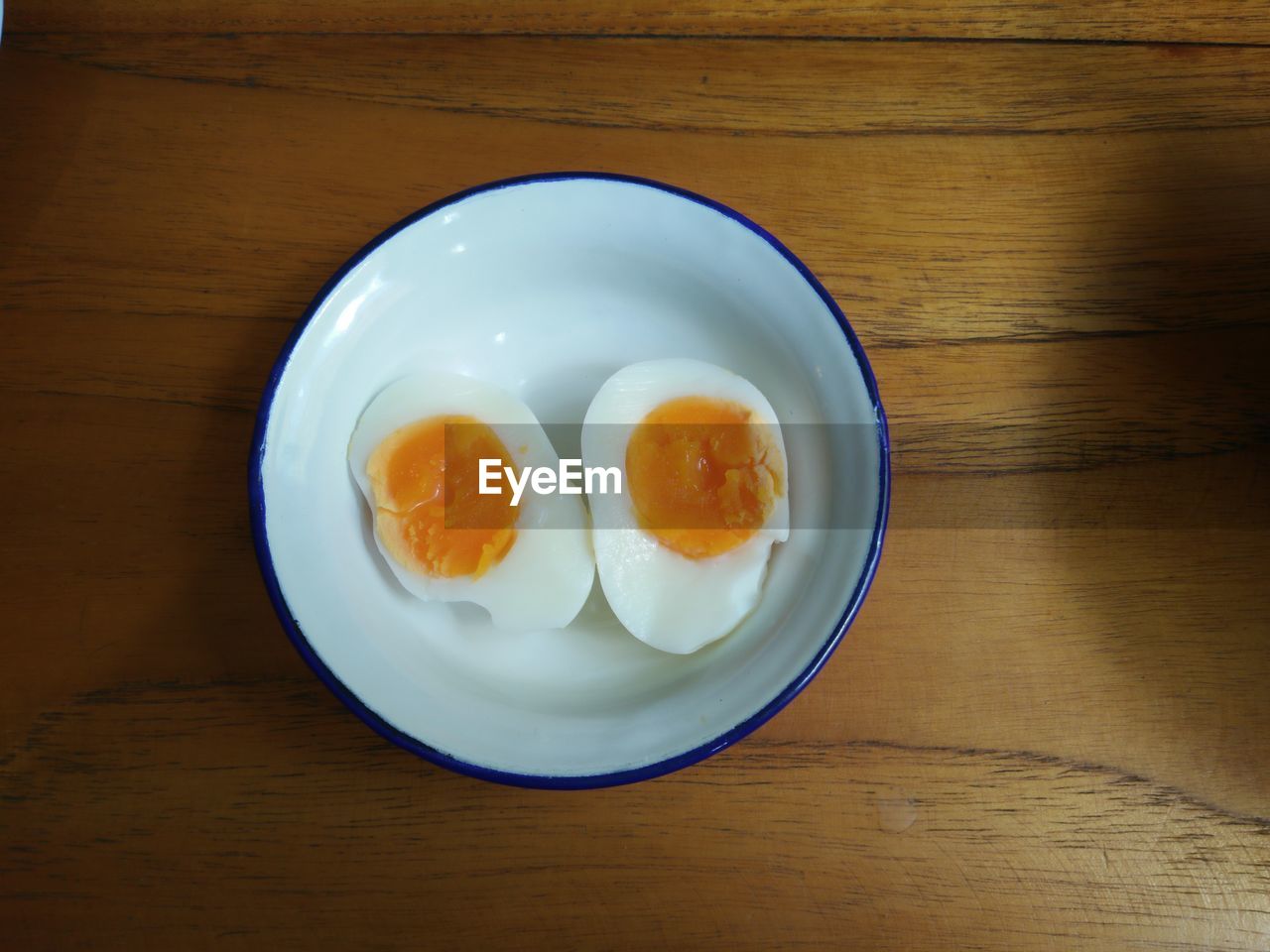 High angle view of boiled egg in bowl on table