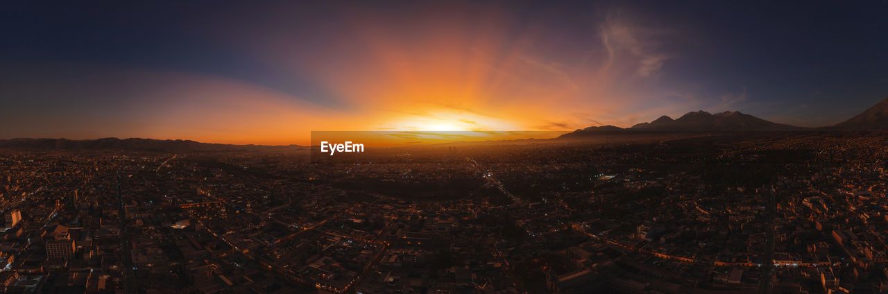 Aerial view of a sunset in arequipa city with chachani volcano as background, peru