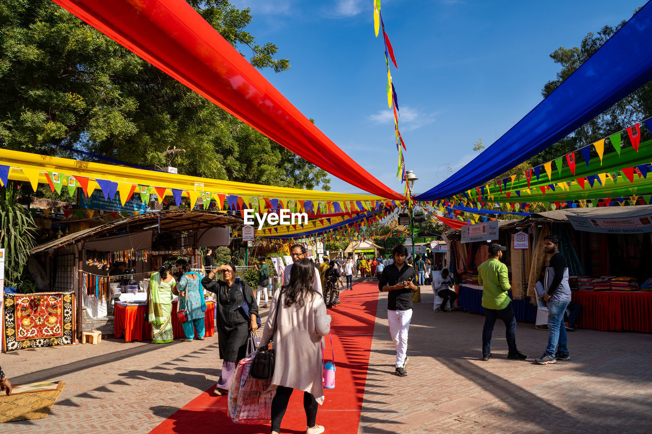 PEOPLE WALKING ON STREET MARKET