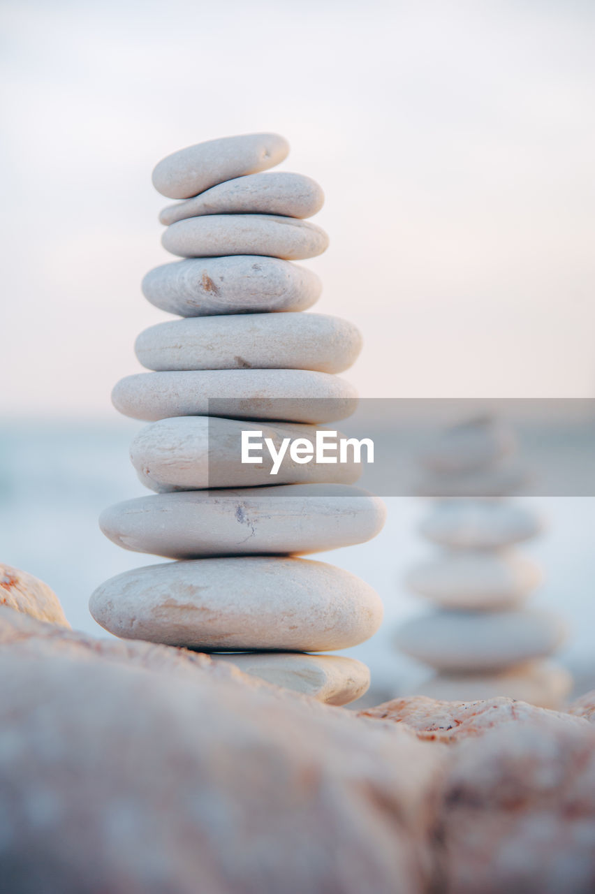 CLOSE-UP OF STACK OF PEBBLES