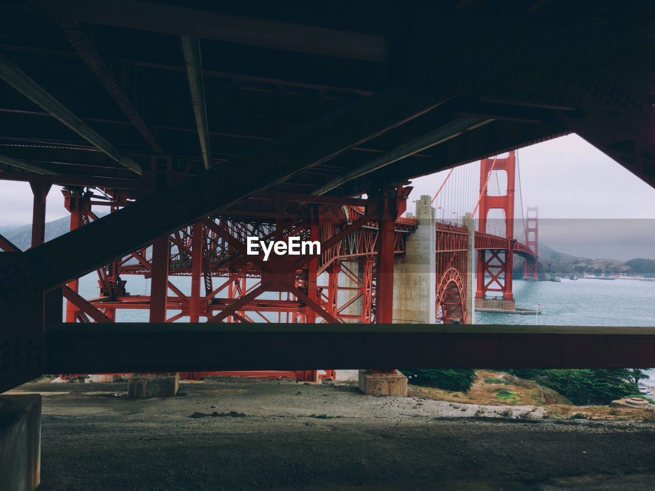 Low angle view of golden gate over river in city