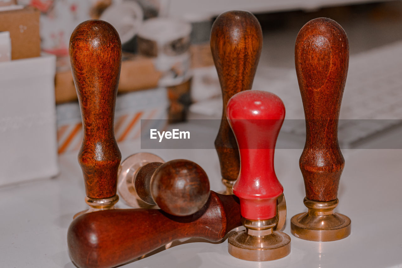 red, indoors, wood, no people, brown, close-up, art, still life, table, business