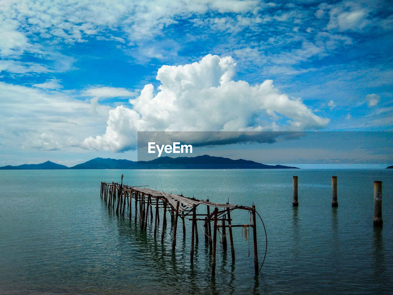 Pier on sea against sky