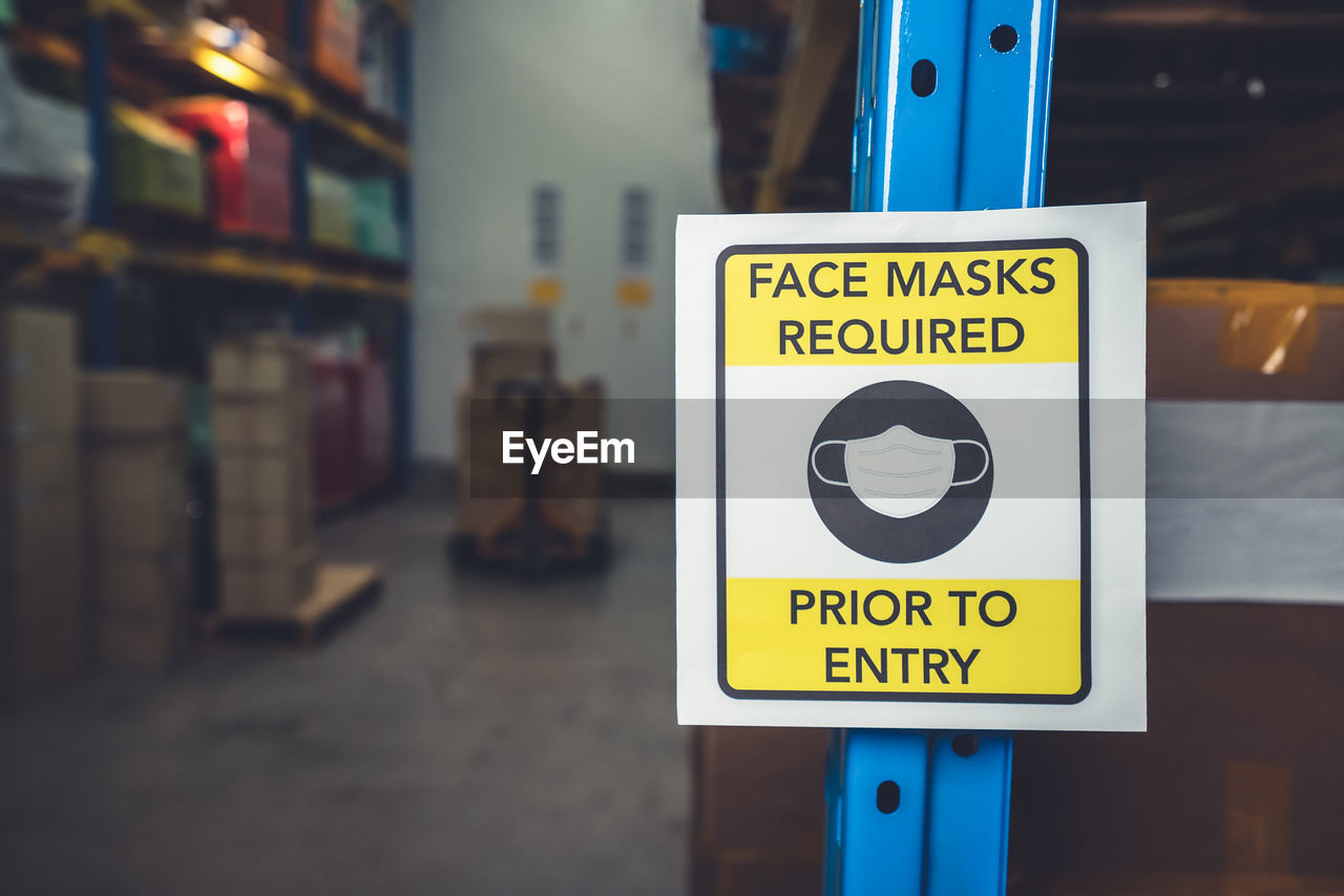 Close-up of warning sign at warehouse