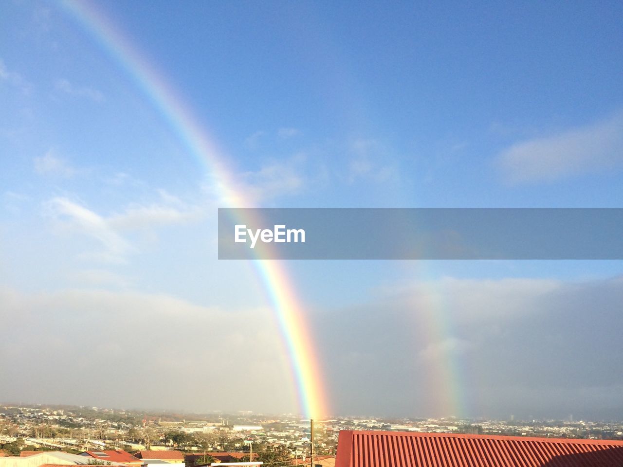 SCENIC VIEW OF RAINBOW AGAINST SKY DURING SUNSET