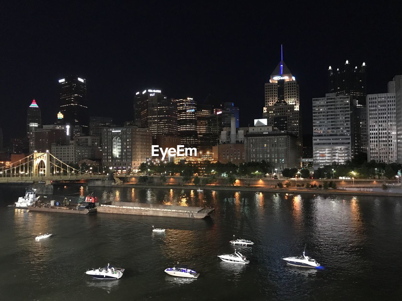 VIEW OF SKYSCRAPERS AT NIGHT