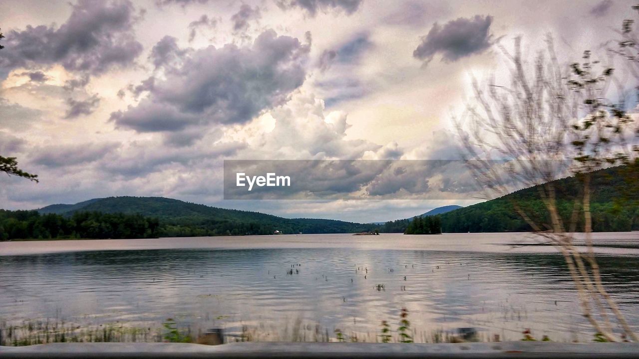 SCENIC VIEW OF LAKE AND TREES AGAINST SKY