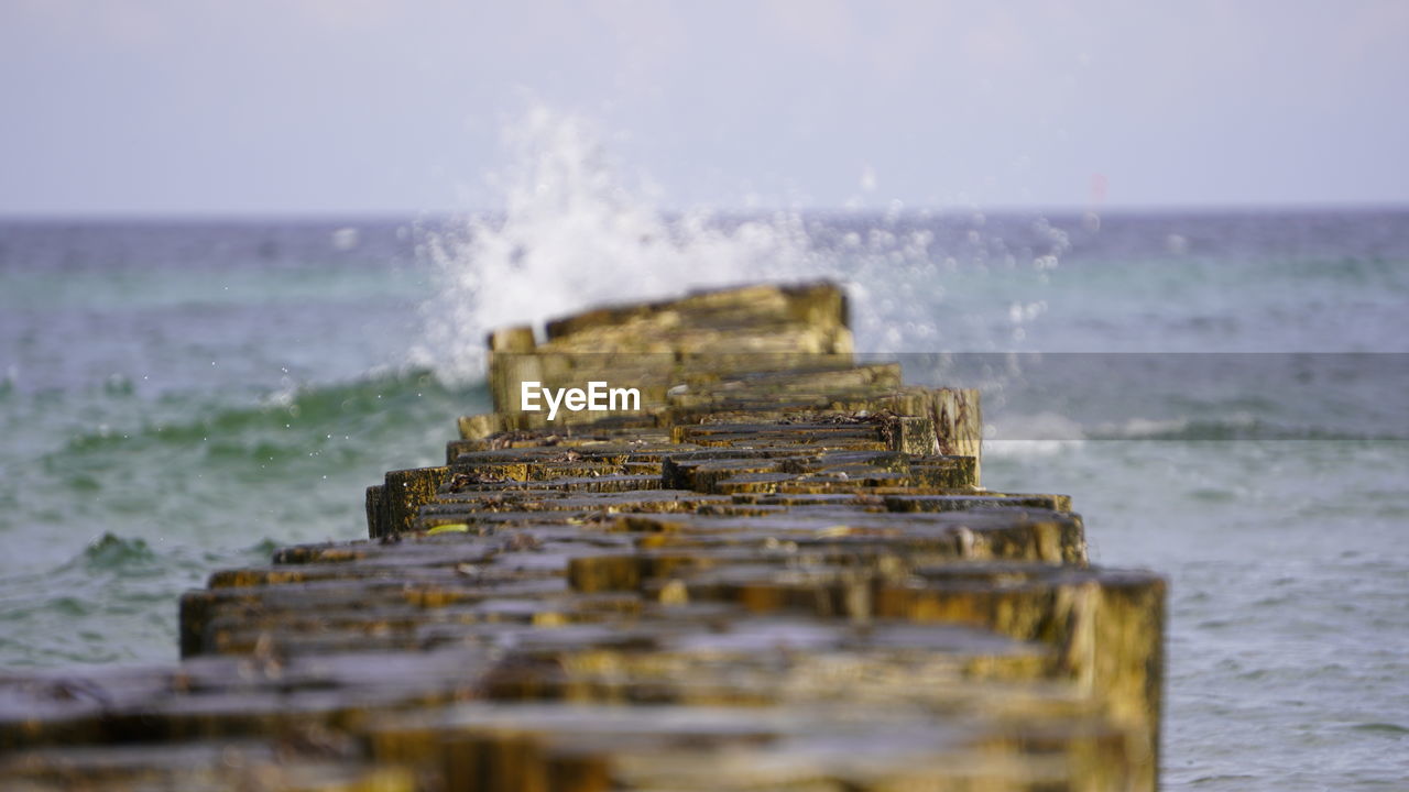 CLOSE-UP OF WAVE SPLASHING ON SHORE