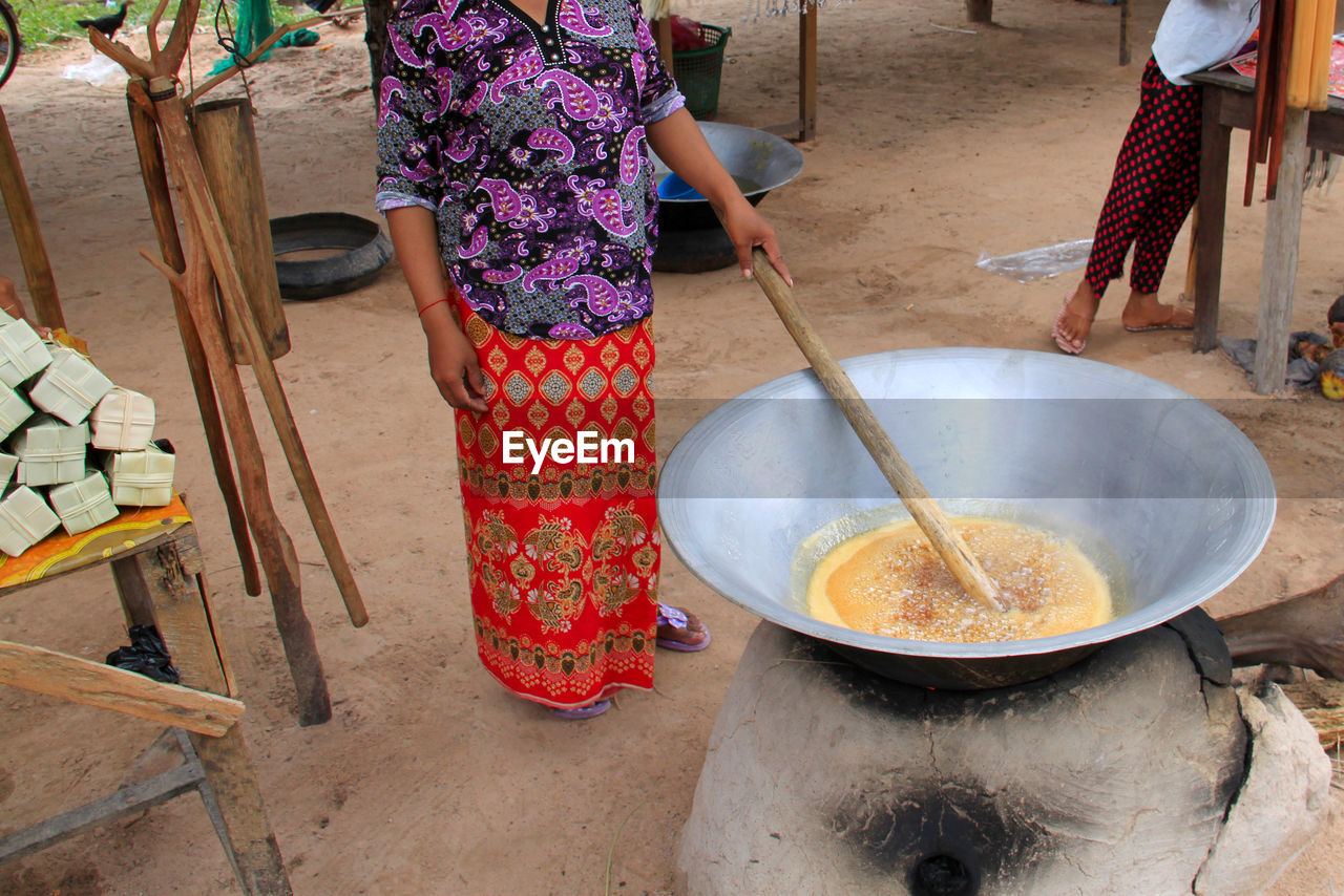 Midsection of woman having food