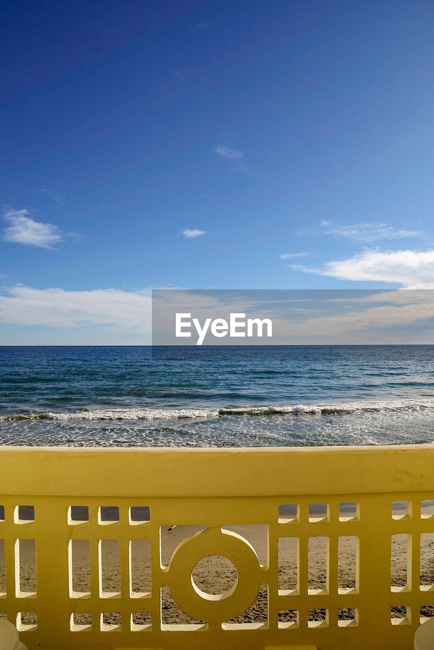 VIEW OF BEACH AGAINST BLUE SKY