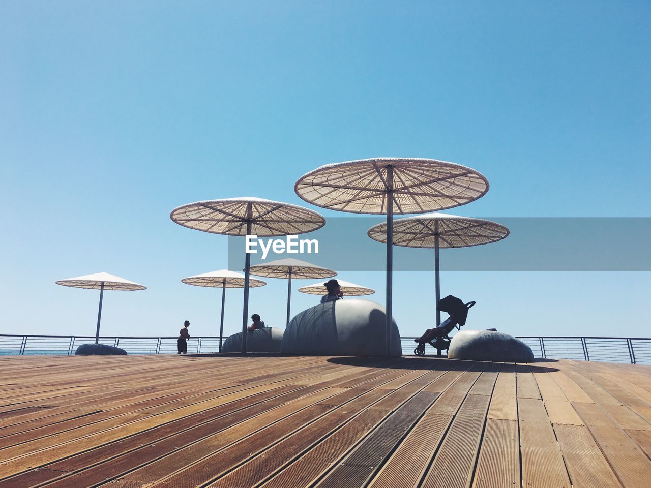 People sitting in cafe at beach