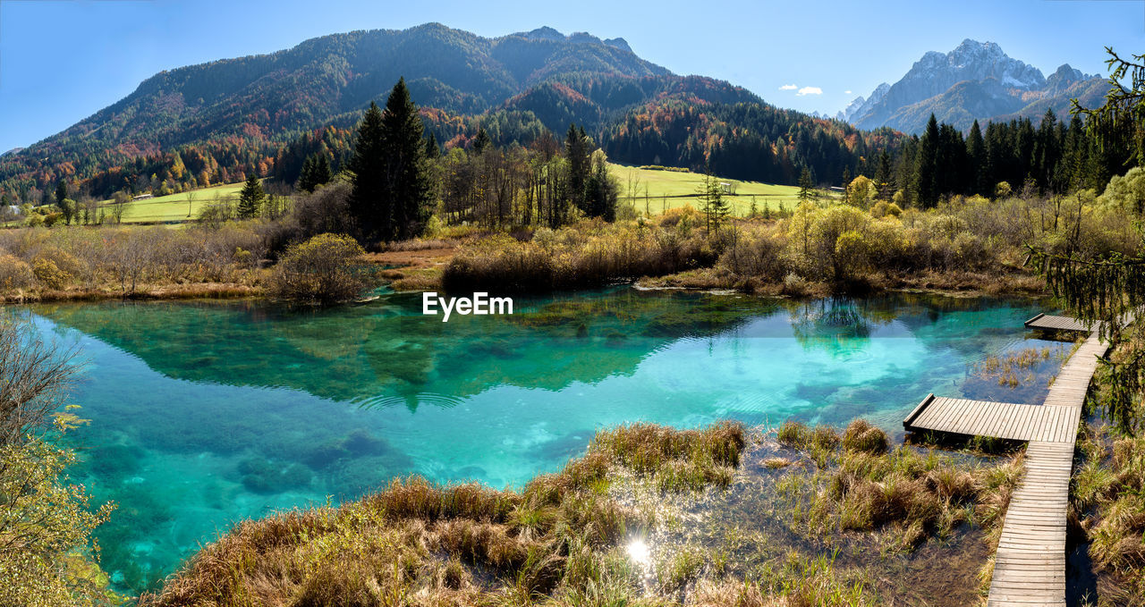 Scenic view of lake and mountains against sky