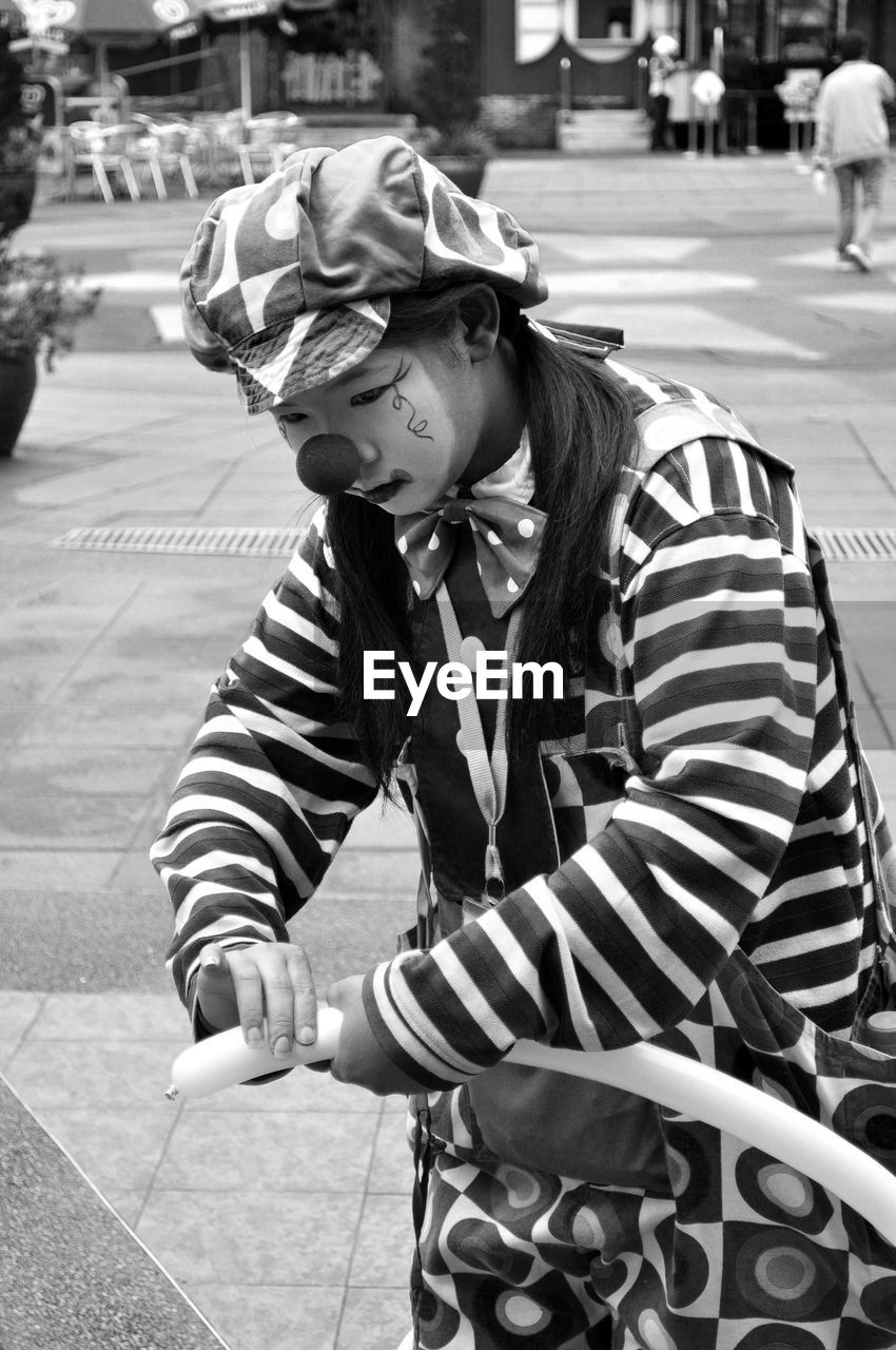 Portrait of a young man dressed as clown