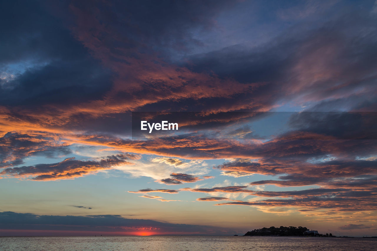 Scenic view of dramatic sky over sea